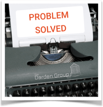 typewriter with the words problem solved written