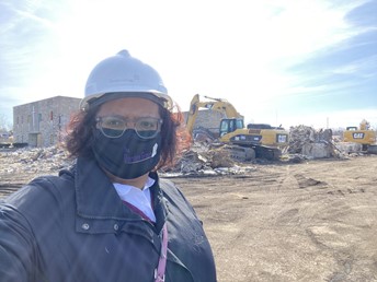 akilah on construction site wearing mask and hardhat